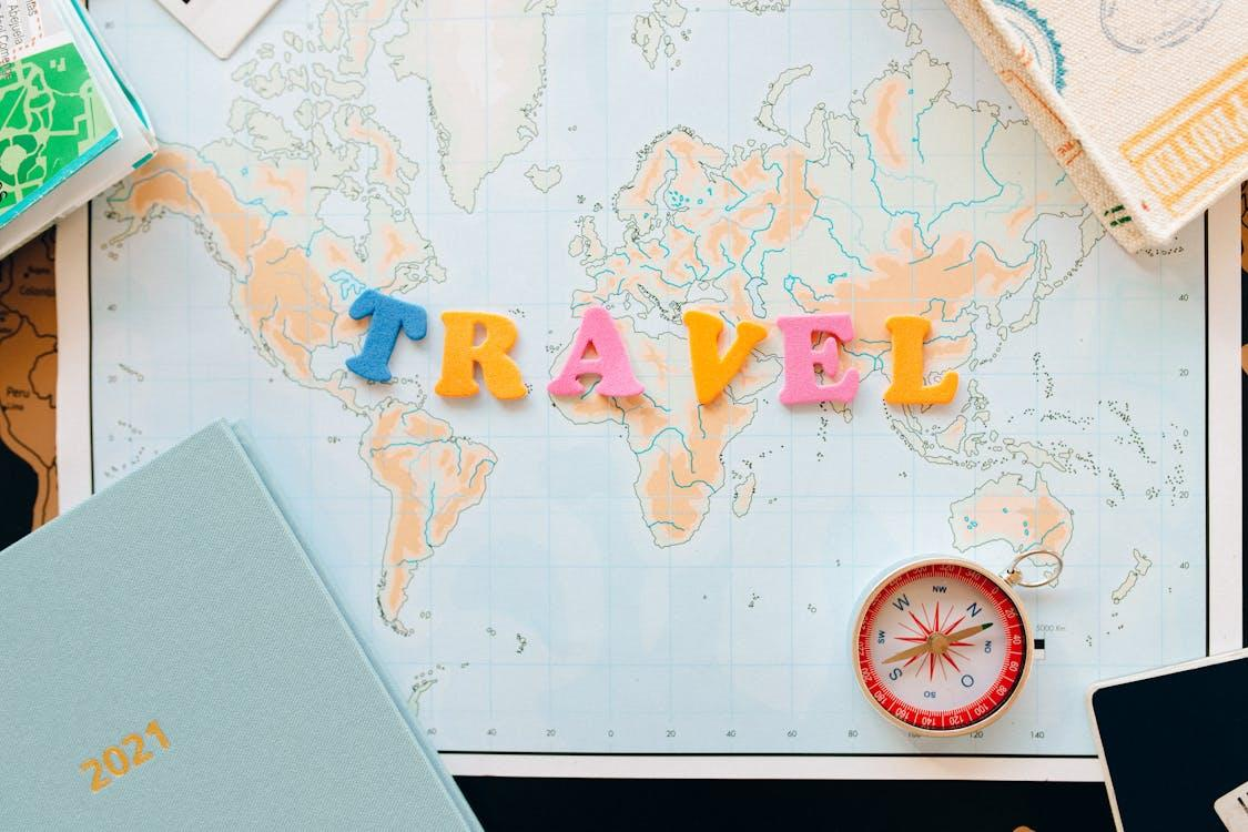 A map and compass, symbolizing the importance of preparation and direction when traveling internationally with minors.