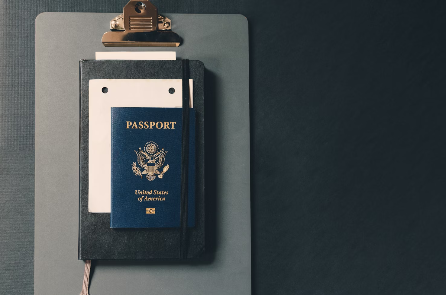 A passport on a clipboard 