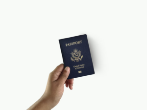 A hand holding a passport